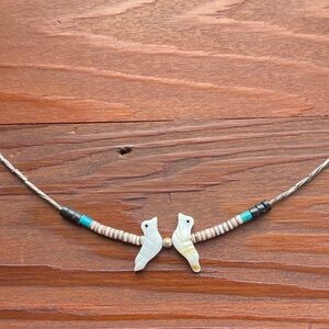 Necklace with carved birds
